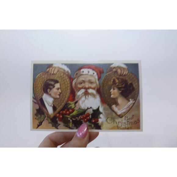 Best Christmas Wishes, Santa holding Man and Woman Portraits, Rare Postcard, - Picture 1 of 2